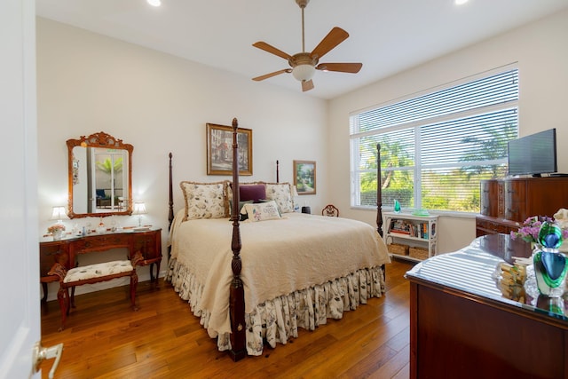 bedroom with hardwood / wood-style floors and ceiling fan