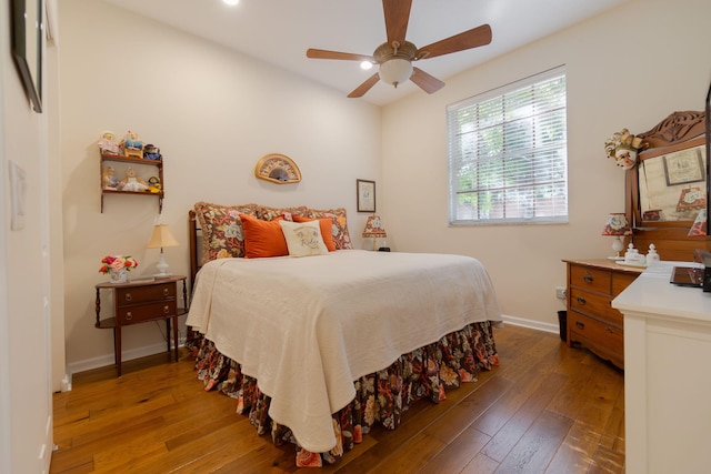 bedroom featuring hardwood / wood-style flooring and ceiling fan