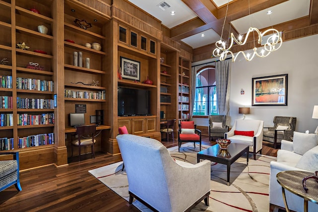 living room with coffered ceiling, built in features, beamed ceiling, a chandelier, and wood-type flooring