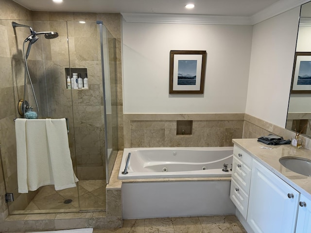 bathroom featuring vanity, separate shower and tub, and ornamental molding