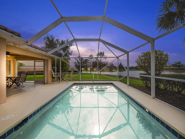 outdoor pool with a lanai and a patio