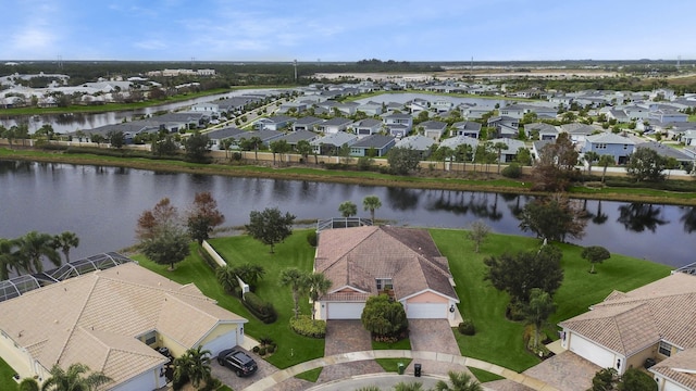 bird's eye view featuring a water view and a residential view