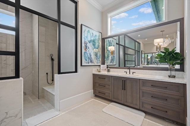 bathroom featuring tile patterned flooring, vanity, ornamental molding, and tiled shower