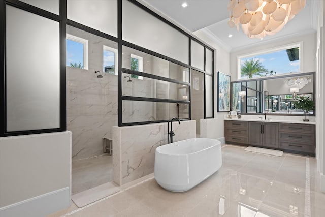 bathroom with crown molding, vanity, and shower with separate bathtub