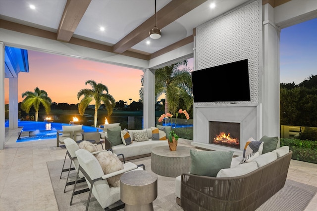 view of patio with an outdoor living space with a fireplace