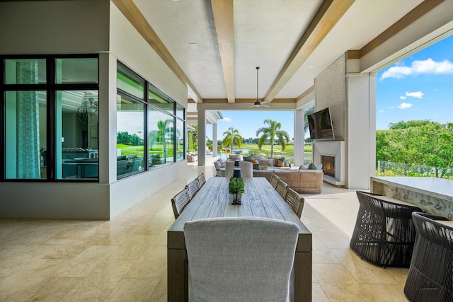 view of patio featuring ceiling fan