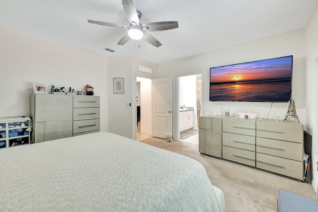 carpeted bedroom featuring connected bathroom and ceiling fan