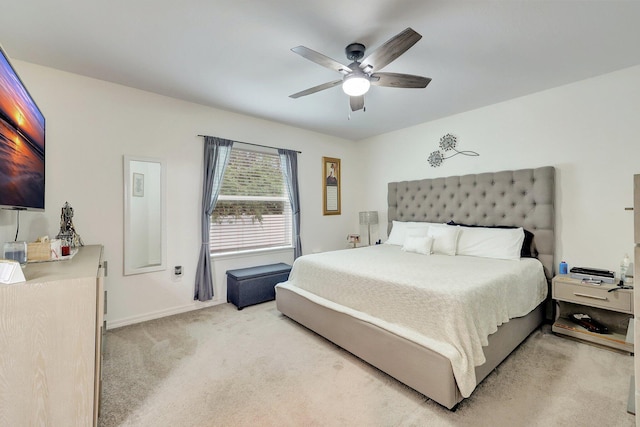 bedroom featuring light carpet and ceiling fan