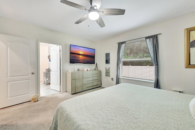 bedroom with light carpet and ceiling fan