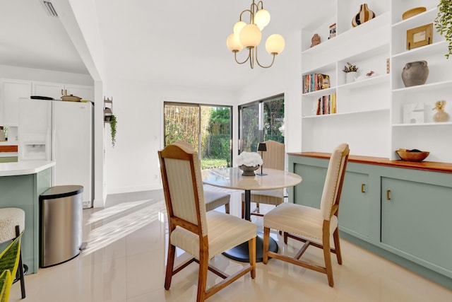 dining space featuring a notable chandelier, light tile patterned floors, and vaulted ceiling