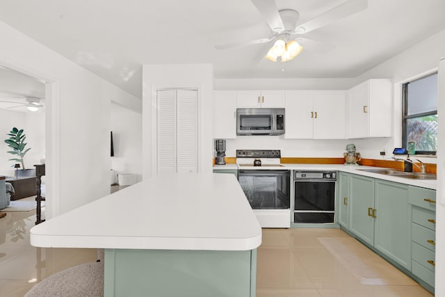 kitchen featuring dishwasher, white cabinets, electric stove, sink, and green cabinetry