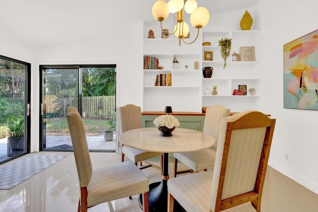 dining area with built in shelves, vaulted ceiling, and an inviting chandelier