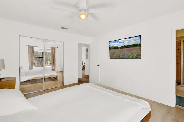 bedroom with ceiling fan, a closet, and light wood-type flooring