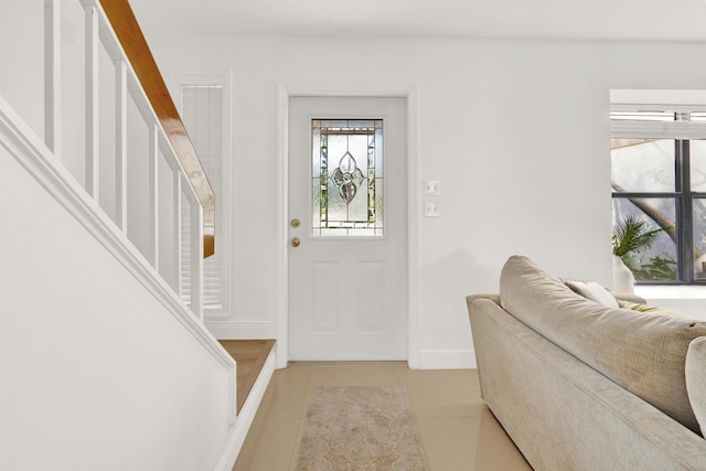 foyer featuring light tile patterned floors