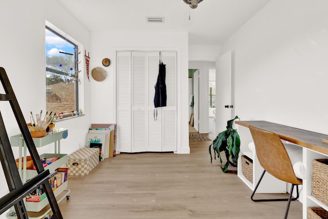 corridor with light wood-type flooring