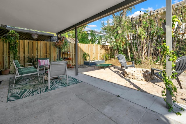 view of patio / terrace with an outdoor fire pit