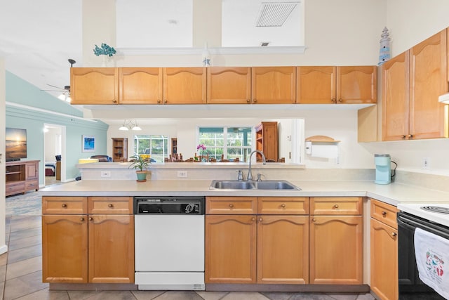 kitchen featuring kitchen peninsula, a high ceiling, white appliances, and sink