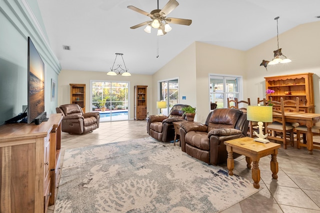 tiled living room with ceiling fan and lofted ceiling