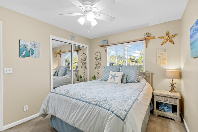 bedroom with carpet flooring, multiple windows, a closet, and ceiling fan