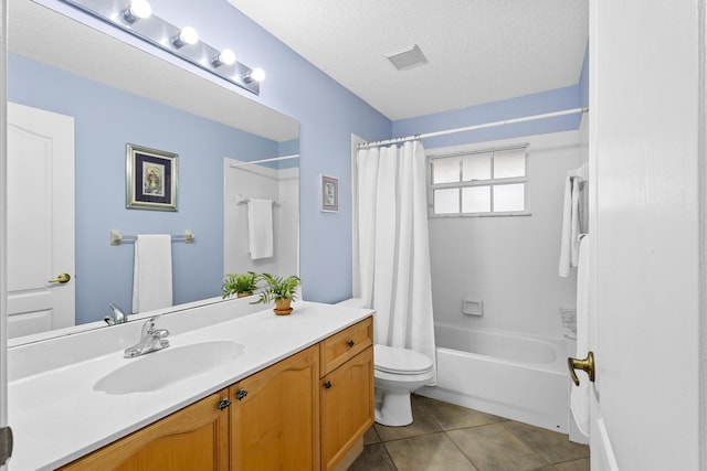 full bathroom with vanity, tile patterned floors, shower / bath combination with curtain, toilet, and a textured ceiling