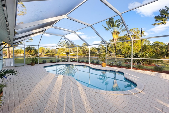 view of pool featuring a lanai and a patio area