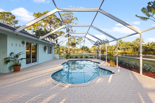 view of pool featuring a patio area and a lanai