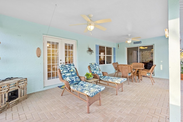 view of patio featuring ceiling fan and french doors