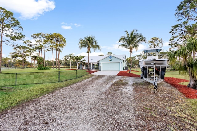 view of front of house featuring a front yard and a garage