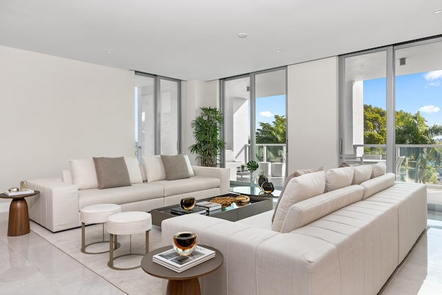 living room with a wall of windows and a wealth of natural light