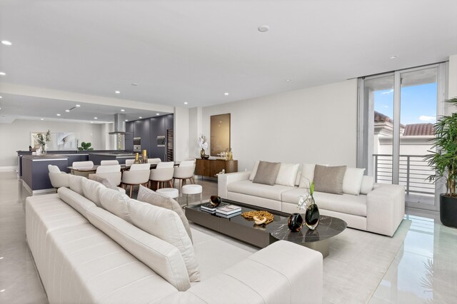 tiled living room with expansive windows