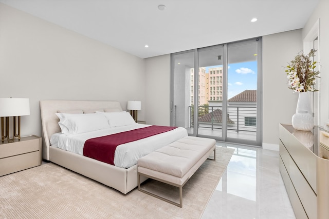 bedroom featuring access to exterior and floor to ceiling windows