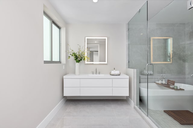 bathroom with tile patterned flooring, a shower with shower door, and vanity