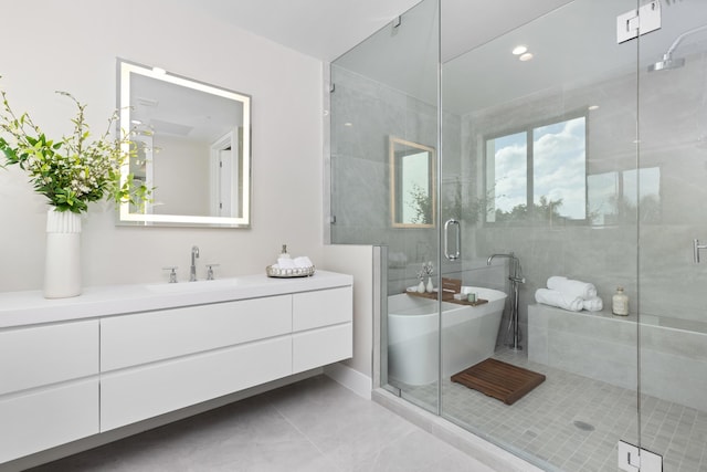 bathroom with vanity, tile patterned flooring, and independent shower and bath