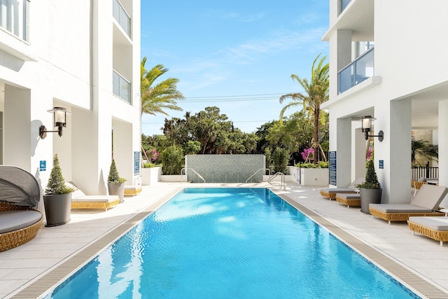 view of pool featuring a patio