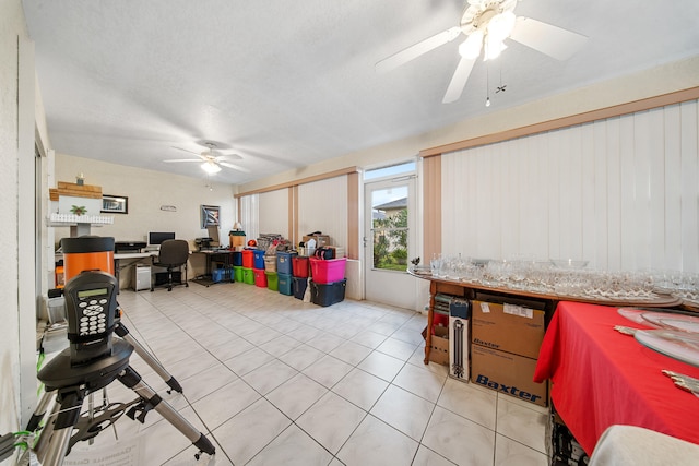 recreation room with ceiling fan and light tile patterned floors