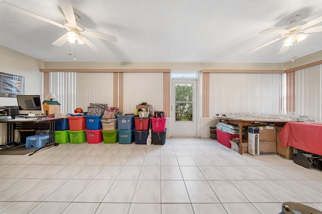 interior space with ceiling fan