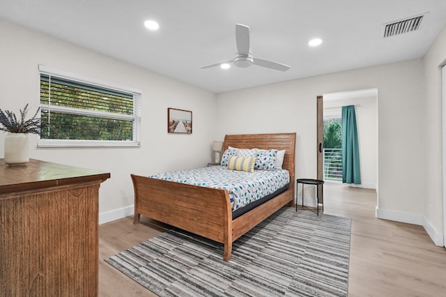 bedroom with ceiling fan and light hardwood / wood-style floors