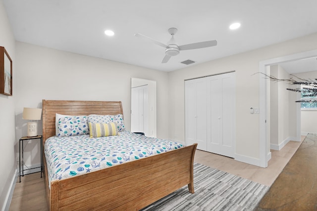 bedroom featuring light hardwood / wood-style flooring and ceiling fan