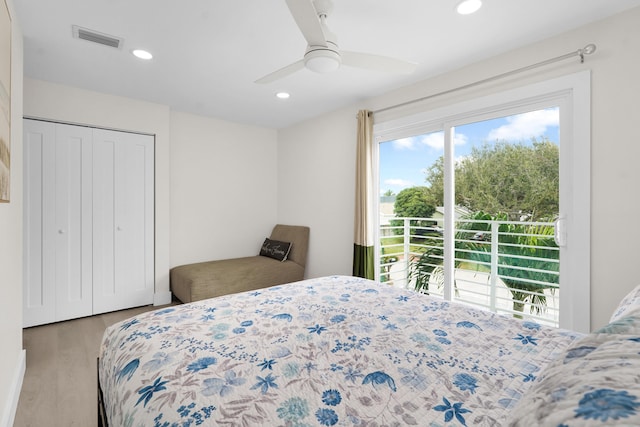 bedroom with ceiling fan, light hardwood / wood-style floors, access to exterior, and a closet