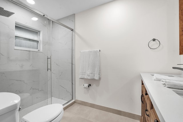 bathroom featuring an enclosed shower, vanity, toilet, and tile patterned flooring