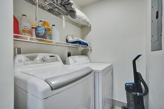 laundry area featuring washing machine and dryer and electric panel