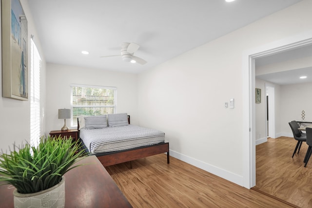 bedroom featuring ceiling fan and light hardwood / wood-style floors