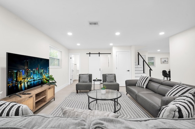 living room featuring a barn door