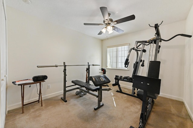 exercise room with ceiling fan