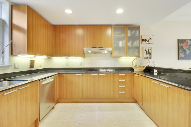 kitchen featuring dishwasher, stovetop, and light tile patterned flooring