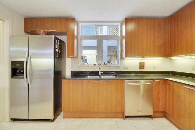 kitchen with sink and appliances with stainless steel finishes