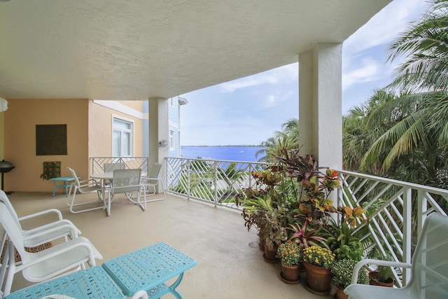 balcony featuring a water view