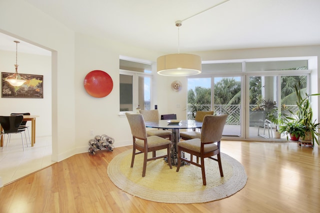 dining area with hardwood / wood-style flooring