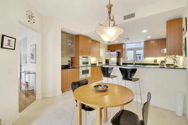 dining room featuring light tile patterned floors