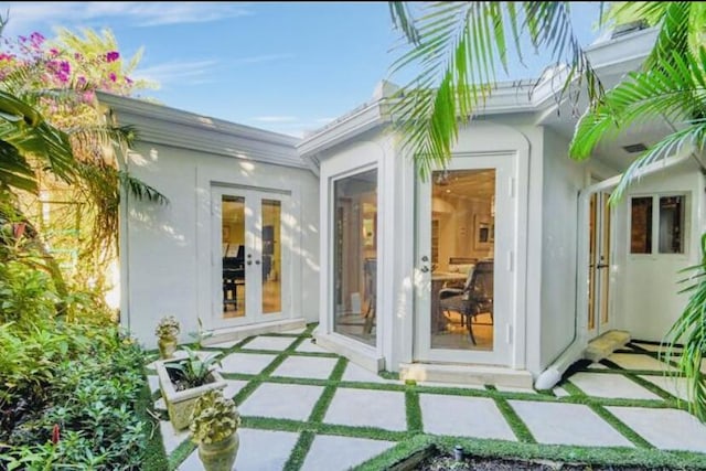 property entrance with french doors and a patio